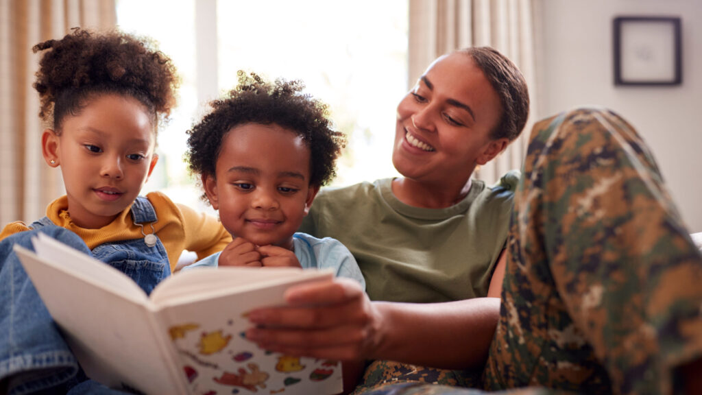 Military Service Member Reading to Kids