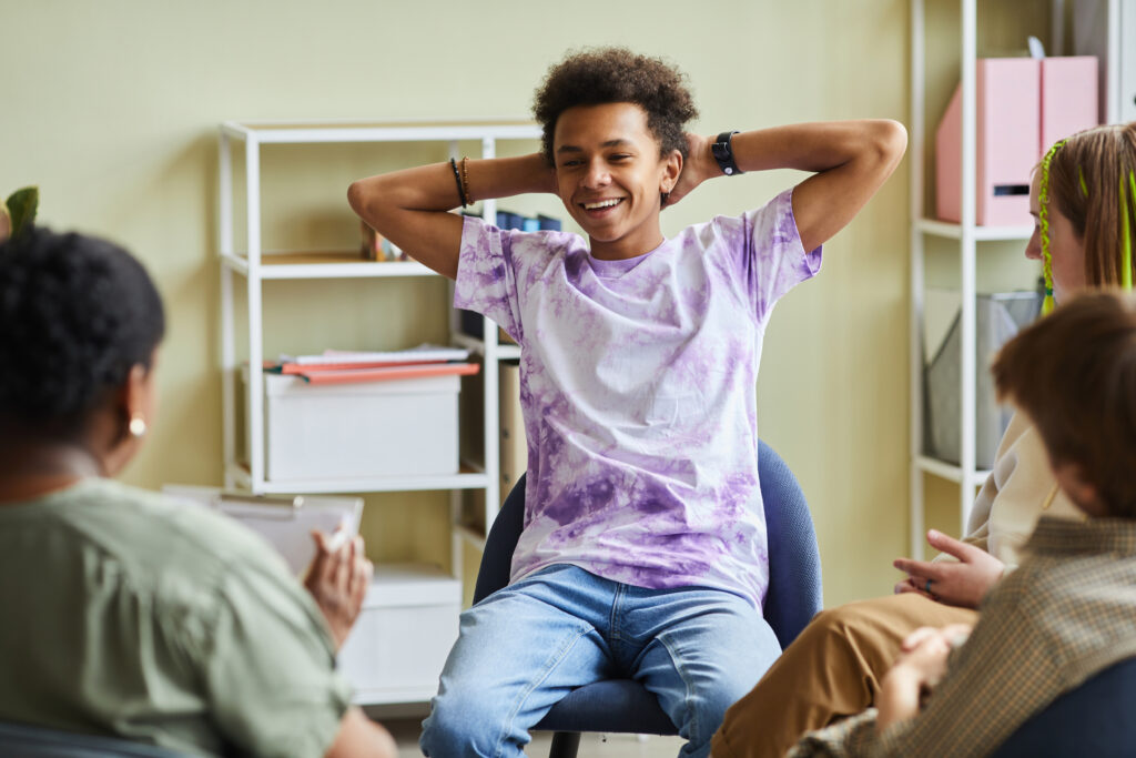 Military teenager attending group therapy