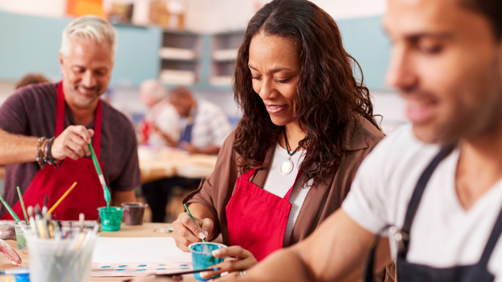 group of adults painting