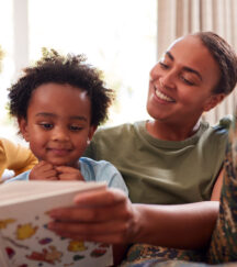 Military Service Member Reading to Kids