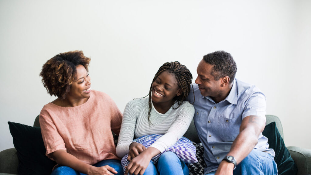 Military teen talking to parents at home