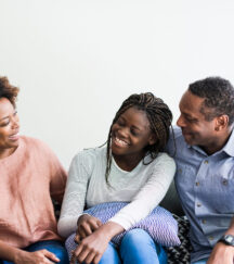 Military teen talking to parents at home